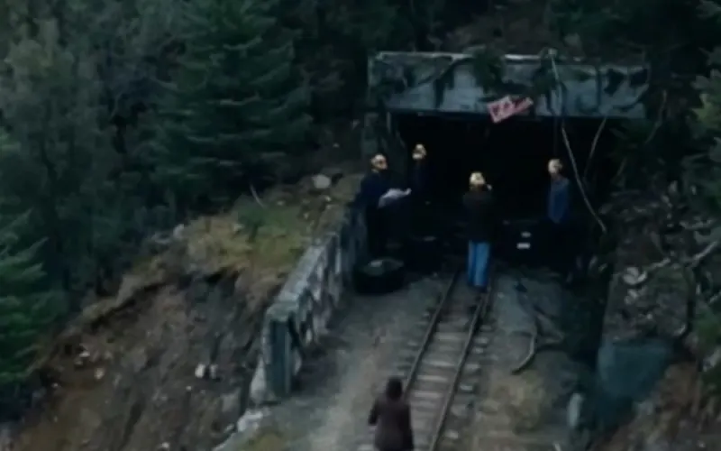 A still from Dark Hollow: a mine entrance in a forest